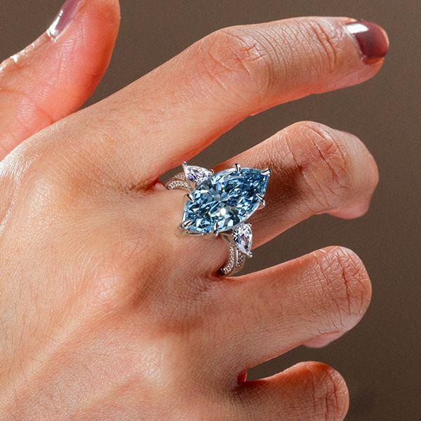 Three Stone Marquise Cut Blue Simulated Sapphire Engagement Ring in Sterling Silver