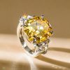 Three Stone Emerald Cut Yellow Sapphire Engagement Ring in Rhodium Plated Sterling Silver