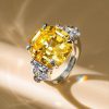 Three Stone Emerald Cut Yellow Sapphire Engagement Ring in Rhodium Plated Sterling Silver