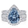 Pear Cut Blue Topaz Engagement Ring Set in Rhodium Plated Sterling Silver