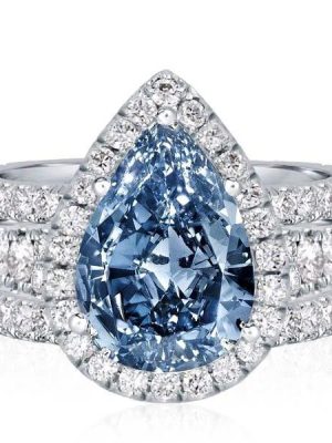 Pear Cut Blue Topaz Engagement Ring Set in Rhodium Plated Sterling Silver
