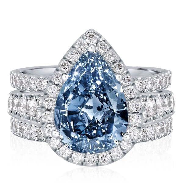 Pear Cut Blue Topaz Engagement Ring Set in Rhodium Plated Sterling Silver