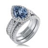 Pear Cut Blue Topaz Engagement Ring Set in Rhodium Plated Sterling Silver