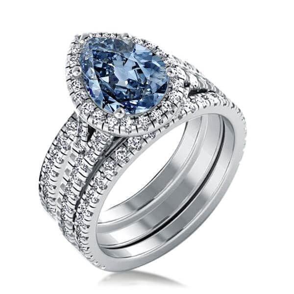 Pear Cut Blue Topaz Engagement Ring Set in Rhodium Plated Sterling Silver