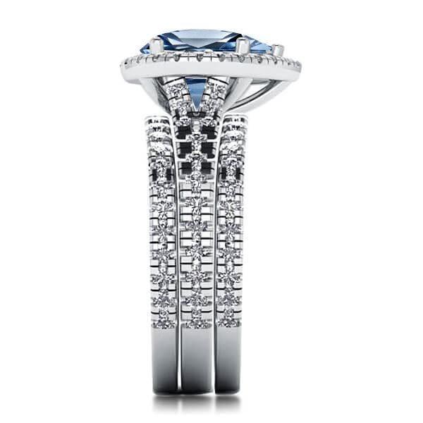 Pear Cut Blue Topaz Engagement Ring Set in Rhodium Plated Sterling Silver