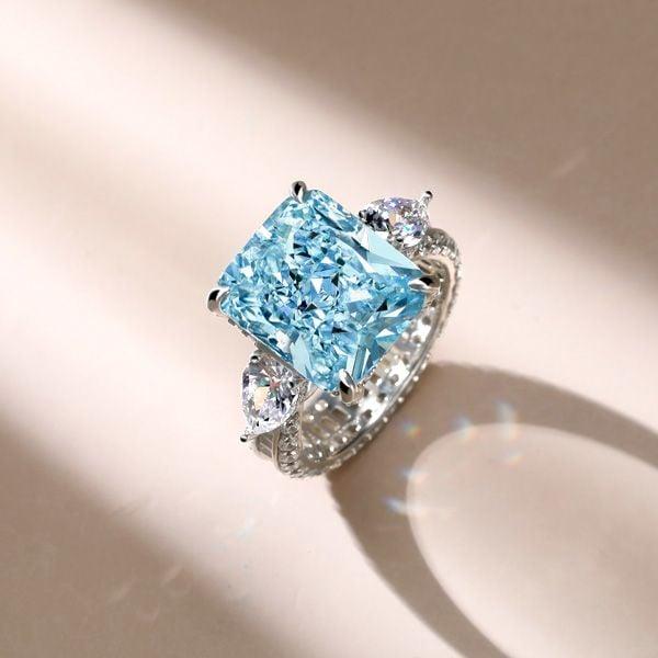 Three Stone Radiant Cut Aquamarine Engagement Ring in Rhodium Plated Sterling Silver