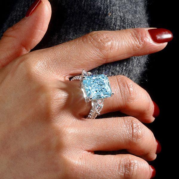 Three Stone Radiant Cut Aquamarine Engagement Ring in Rhodium Plated Sterling Silver
