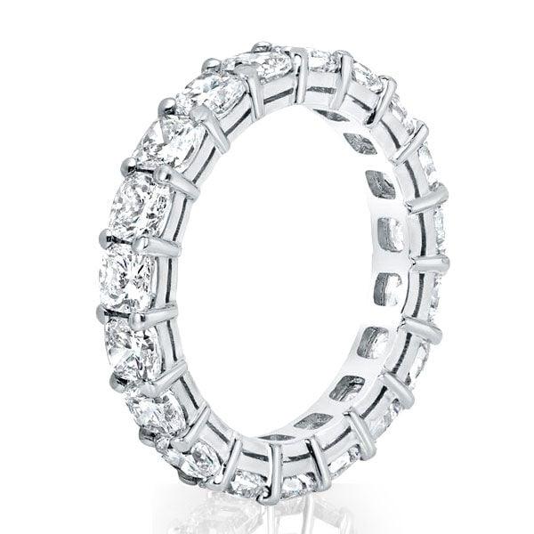Created White Sapphire Cushion Cut Eternity Wedding Band in Rhodium-Plated Sterling Silver