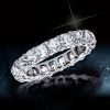 Created White Sapphire Cushion Cut Eternity Wedding Band in Rhodium-Plated Sterling Silver
