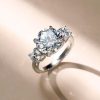 Three Stone Created White Sapphire Engagement Ring in Rhodium Plated Sterling Silver