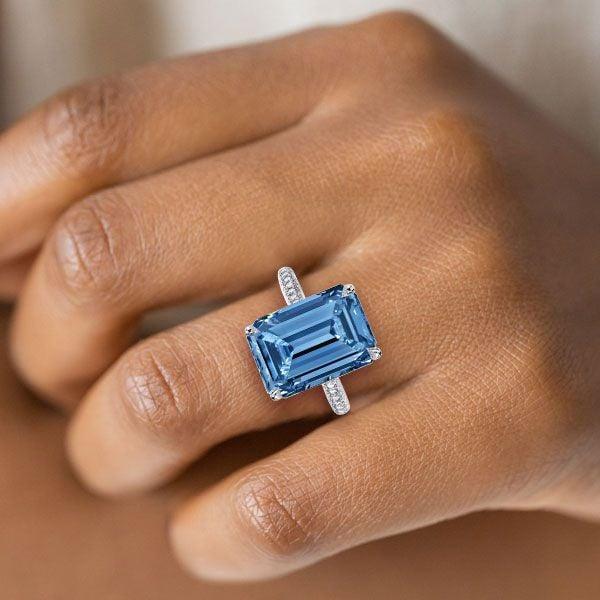 Emerald Cut Aquamarine Engagement Ring in Rhodium Plated Sterling Silver