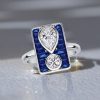 Unique Pear and Round White Blue Sapphire Engagement Ring in Rhodium-Plated Sterling Silver