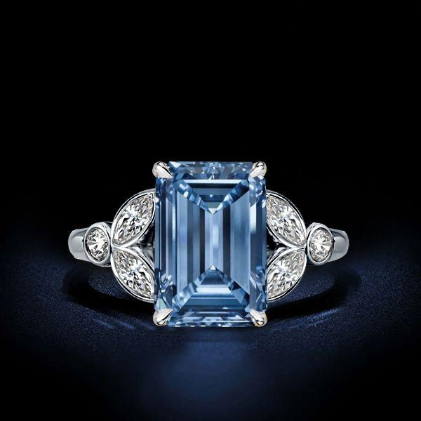 Emerald Cut Blue Topaz Engagement Ring in Sterling Silver