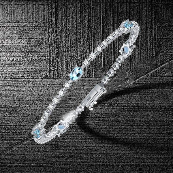 Aquamarine and White Stone Oval Cut Tennis Bracelet in Sterling Silver