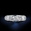 Four Stone Created White Sapphire Wedding Band in Rhodium Plated Sterling Silver