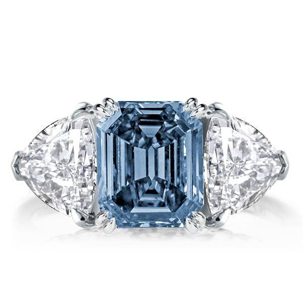 Three Stone Emerald Blue Topaz Engagement Ring in Rhodium Plated Sterling Silver
