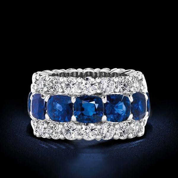 Cushion Cut Created Sapphire Triple Row Eternity Wedding Band in Sterling Silver