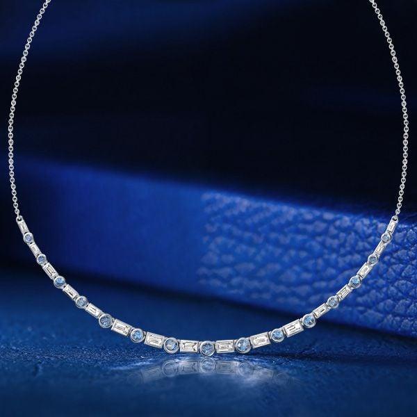 Blue Topaz Baguette and Round Cut Bezel Set Necklace in Rhodium-Plated Sterling Silver