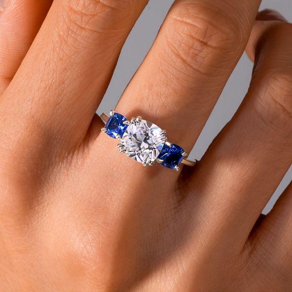 Cushion Cut Blue Topaz Three Stone Engagement Ring in Sterling Silver