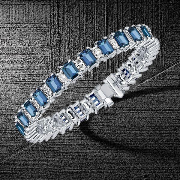 Emerald Cut Blue Topaz Tennis Bracelet in Sterling Silver