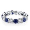 Round Cut Blue Sapphire Eternity Wedding Band in Rhodium Plated Sterling Silver