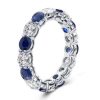 Round Cut Blue Sapphire Eternity Wedding Band in Rhodium Plated Sterling Silver