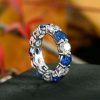 Round Cut Blue Sapphire Eternity Wedding Band in Rhodium Plated Sterling Silver