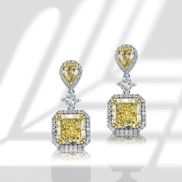 Sterling Silver Drop Earrings with 9.52 CT. TW. Center Stone