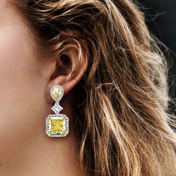 Sterling Silver Drop Earrings with 9.52 CT. TW. Center Stone