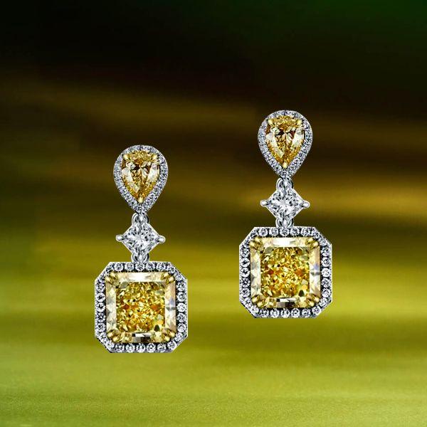 Sterling Silver Drop Earrings with 9.52 CT. TW. Center Stone