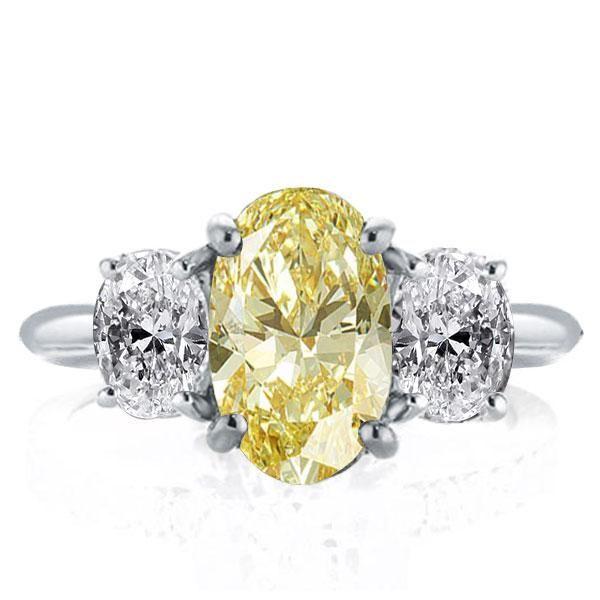 Oval Created Topaz Three Stone Engagement Ring in Sterling Silver