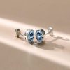 Oval Blue Topaz Stud Earrings in Sterling Silver Bezel Setting