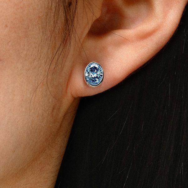 Oval Blue Topaz Stud Earrings in Sterling Silver Bezel Setting