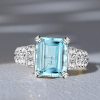 Art Deco Emerald Cut Aquamarine Engagement Ring in Rhodium Plated Sterling Silver