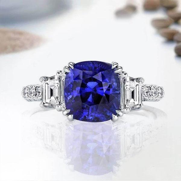 Cushion Cut Created Sapphire Three Stone Engagement Ring in Sterling Silver