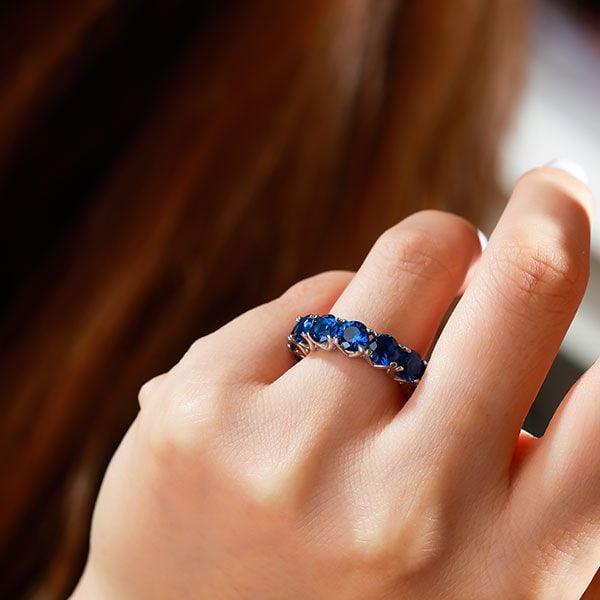 Eternity Round Created Sapphire Wedding Band in 925 Sterling Silver (6.55 CT.TW)